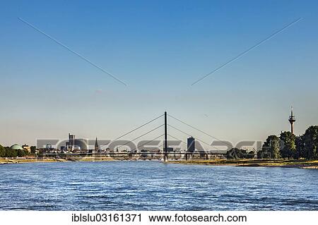 Stock Image - "View over the Rhine to Medienhafen, media harbour, Dusseldorf, Rhineland, North Rhine-Westphalia, Germany, Europe". Fotosearch