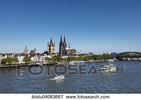 Stock Photo - "View over the Rhine to the historic centre with Cologne Cathedral, Great St. Martin Church and City Hall, Cologne, North Rhine-Westphalia, Germany, Europe". Fotosearch