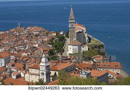 "View over the roof tops with sea in the distance and Town Hall in foreground, Piran, Slovenia, Europe" View Large Photo Image Stock Image - "View over the roof tops with sea in the distance and Town Hall in foreground, Piran, Slovenia, Europe". Fotosearch
