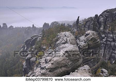 "View over the Schrammsteine ​​the Elbe Sandstone Mountains, in the autumn, Saxon Switzerland, Bad Schandau, Saxony, Germany, Europe" View Large Photo Image Stock Image - "View over the Schrammsteine ​​the Elbe Sandstone Mountains, in the autumn, Saxon Switzerland, Bad Schandau, Saxony, Germany, Europe". Fotosearch