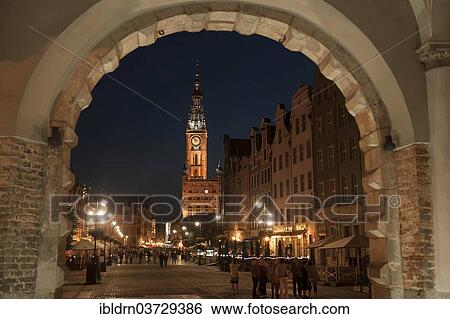 "View through Green Gate or Brama Zielona towards the houses on Long Market or Dlugi Targ and the clock tower of Main Town Hall, in the evening, Gdansk, Pomeranian Voivodeship, Poland, Europe" View Large Photo Image Stock Photograph - "View through Green Gate or Brama Zielona towards the houses on Long Market or Dlugi Targ and the clock tower of Main Town Hall, in the evening, Gdansk, Pomeranian Voivodeship, Poland, Europe". Fotosearch