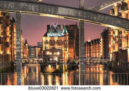 "View through Poggenmuehlenbruecke bridge towards Wasserschloesschen water castle at night, Speicherstadt, Hamburg, Hamburg, Germany, Europe" View Large Photo Image Stock Image - "View through Poggenmuehlenbruecke bridge towards Wasserschloesschen water castle at night, Speicherstadt, Hamburg, Hamburg, Germany, Europe". Fotosearch
