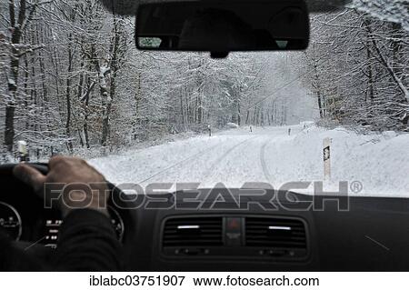 "View through the windscreen during snowfall, snow-covered country road, Georgenborn, Schlangenbad, Hesse, Germany, Europe" View Large Photo Image Stock Photo - "View through the windscreen during snowfall, snow-covered country road, Georgenborn, Schlangenbad, Hesse, Germany, Europe". Fotosearch