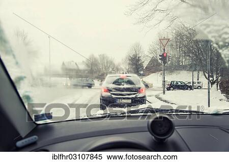 "View through the windscreen of a car at red traffic lights at crossroads, Grevenbroich, Rhineland, North Rhine-Westphalia, Germany, Europe" View Large Photo Image Stock Photography - "View through the windscreen of a car at red traffic lights at crossroads, Grevenbroich, Rhineland, North Rhine-Westphalia, Germany, Europe". Fotosearch