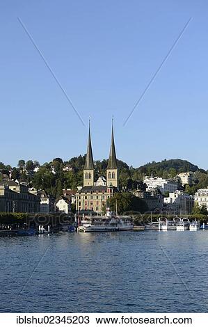 Stock Image - "Views over Lake Lucerne to Hofkirche St. Leodegar church with the twin towers in the old town of Lucerne, Switzerland, Europe". Fotosearch