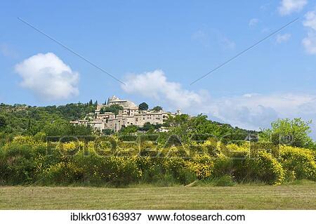 Stock Photo - "Village and rural landscape, Simiane la Rotonde, Provence, Region Provence-Alpes-Cote d? ÇÖAzur, France, Europe". Fotosearch