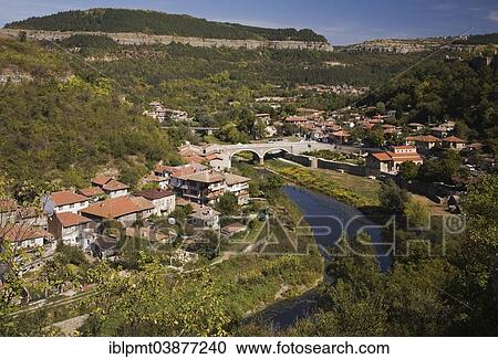 Stock Image - "Village and Yantra river in autumn, Veliko Tarnovo, Bulgaria, Europe". Fotosearch