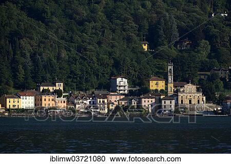"Village of Porto Ceresio with the Parish Church of Chiesa Sancto Ambrosio on Lake Lugano or Lago di Lugano, Porto Ceresio, Lombardy, Italy, Europe" View Large Photo Image Stock Image - "Village of Porto Ceresio with the Parish Church of Chiesa Sancto Ambrosio on Lake Lugano or Lago di Lugano, Porto Ceresio, Lombardy, Italy, Europe". Fotosearch