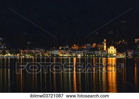 "Village of Porto Ceresio with the Parish Church of Chiesa Sancto Ambrosio on Lake Lugano or Lago di Lugano at night, Porto Ceresio, Lombardy, Italy, Europe" View Large Photo Image Stock Photo - "Village of Porto Ceresio with the Parish Church of Chiesa Sancto Ambrosio on Lake Lugano or Lago di Lugano at night, Porto Ceresio, Lombardy, Italy, Europe". Fotosearch