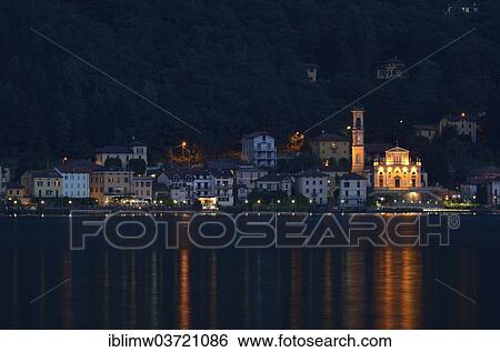 "Village of Porto Ceresio with the Parish Church of Chiesa Sancto Ambrosio on Lake Lugano or Lago di Lugano at night, Porto Ceresio, Lombardy, Italy, Europe" View Large Photo Image Stock Photograph - "Village of Porto Ceresio with the Parish Church of Chiesa Sancto Ambrosio on Lake Lugano or Lago di Lugano at night, Porto Ceresio, Lombardy, Italy, Europe". Fotosearch