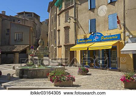 Stock Photography - "Village square with the village fountain, Valensole, Provence, Region Provence-Alpes-Cote d? ÇÖAzur, France, Europe". Fotosearch