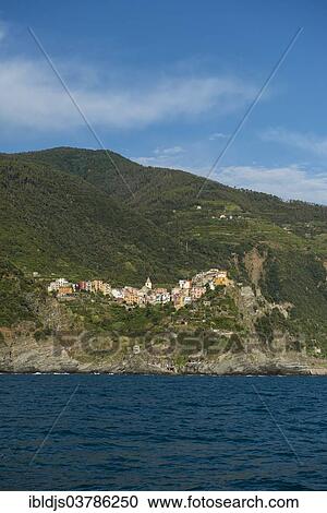 "Village with colorful houses by the sea, Corniglia, Cinque Terre, UNESCO World Heritage Site, Province of La Spezia, Liguria, Italy, Europe" View Large Photo Image Stock Image - "Village with colorful houses by the sea, Corniglia, Cinque Terre, UNESCO World Heritage Site, Province of La Spezia, Liguria, Italy, Europe". Fotosearch