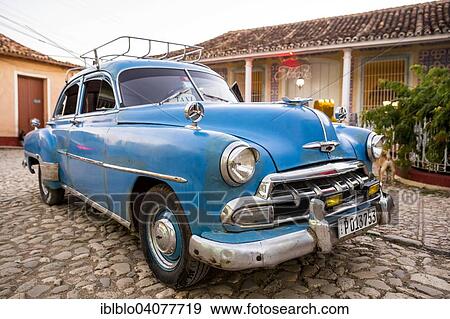 Stock Photo - "Vintage car, old road cruiser, historic centre, Trinidad, Sancti Spiritus Province, Cuba, North America". Fotosearch