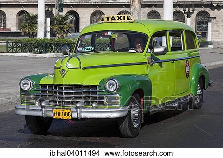 Picture - "Vintage car on the Prado, Havana, Cuba, North America". Fotosearch