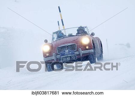 Stock Image - "Vintage car rally, WinterRAID 2013, MG A 1500, built in 1956, Bernina Pass, St. Moritz, Engadin, Switzerland, Europe". Fotosearch