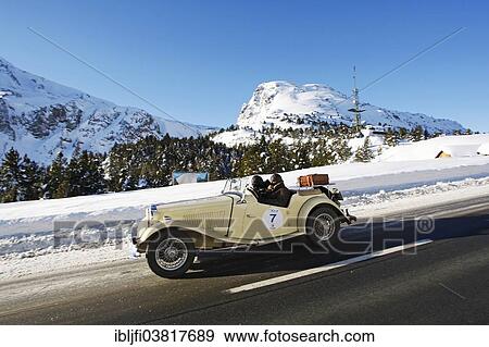 Stock Photo - "Vintage car rally, WinterRAID 2013, MG TD, built in 1952, Ofen Pass, Zernez, Graubunden, Switzerland, Europe". Fotosearch