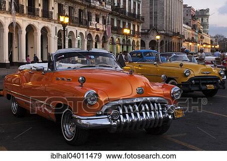 "Vintage cars on the Prado at dusk, at the front a Buick from the 1950s, Havana, Cuba, North America" View Large Photo Image Stock Photo - "Vintage cars on the Prado at dusk, at the front a Buick from the 1950s, Havana, Cuba, North America". Fotosearch