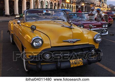 "Vintage cars on the Prado at dusk, Havana, Cuba, North America" View Large Photo Image Stock Image - "Vintage cars on the Prado at dusk, Havana, Cuba, North America". Fotosearch