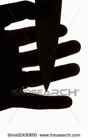 Violent scene with dagger pressed against fingers of a man's hand View Large Photo Image Stock Image - Violent scene with dagger pressed against fingers of a man's hand. Fotosearch