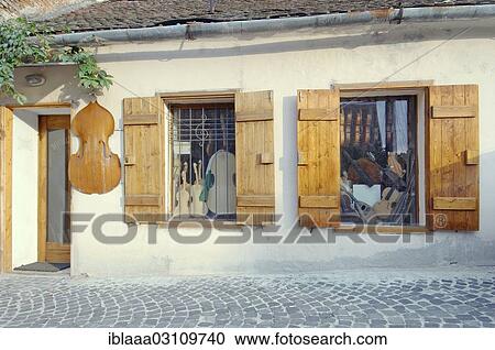 Stock Image - "Violin maker's shop in historical building, Sibiu, Transylvania, Romania, Europe". Fotosearch