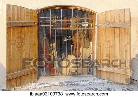 Stock Photo - "Violin maker's shop in historical building, Sibiu, Transylvania, Romania, Europe". Fotosearch