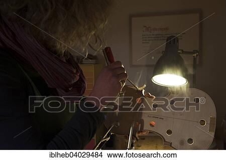 "Violin making, attaching the wooden tun ring" View Large Photo Image Picture - "Violin making, attaching the wooden tun ring". Fotosearch