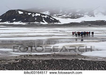 "Visitors walking on Phippsoya, one of the northernmost islands of Svalbard at over 80N, Phippsoya, Sjuoyane, Svalbard Archipelago, Svalbard and Jan Mayen, Norway, Europe" View Large Photo Image Stock Photo - "Visitors walking on Phippsoya, one of the northernmost islands of Svalbard at over 80N, Phippsoya, Sjuoyane, Svalbard Archipelago, Svalbard and Jan Mayen, Norway, Europe". Fotosearch