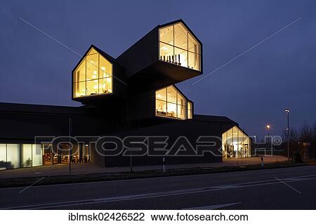 "Vitra Haus building, by Herzog & de Meuron, evening mood, with traffic speeding by, architectural park of the Vitra company, Weil am Rhein, Baden-Wuerttemberg, Germany, Europe" View Large Photo Image Stock Image - "Vitra Haus building, by Herzog & de Meuron, evening mood, with traffic speeding by, architectural park of the Vitra company, Weil am Rhein, Baden-Wuerttemberg, Germany, Europe". Fotosearch