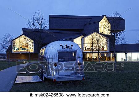 "Vitra Haus building, by Herzog & de Meuron, evening mood, architectural park of the Vitra company, Weil am Rhein, Baden-Wuerttemberg, Germany, Europe" View Large Photo Image Stock Photo - "Vitra Haus building, by Herzog & de Meuron, evening mood, architectural park of the Vitra company, Weil am Rhein, Baden-Wuerttemberg, Germany, Europe". Fotosearch