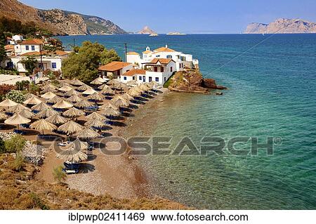 "Vlychos village and beach with umbrellas, Hydra, Saronic Islands, Greece, Europe" View Large Photo Image Stock Photo - "Vlychos village and beach with umbrellas, Hydra, Saronic Islands, Greece, Europe". Fotosearch
