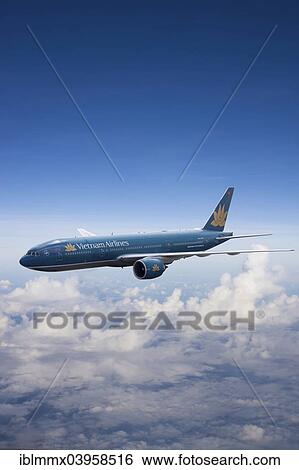 Stock Photograph - VN-A150 Vietnam Airlines Boeing 777-2Q8 ER in flight. Fotosearch