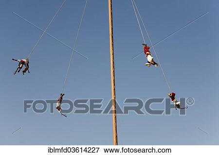Stock Photo - "Voladores performing at a village festival, San Miguel, Cuetzalan, Puebla, Mexico, North America". Fotosearch