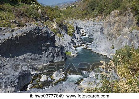 "Volcanic basalt formations, Gole dell’Alcantara gorge, at Ficarazzi, Sicily region, Italy, Europe" View Large Photo Image Stock Photo - "Volcanic basalt formations, Gole dell’Alcantara gorge, at Ficarazzi, Sicily region, Italy, Europe". Fotosearch