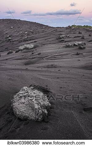 "Volcanic bombs, lava rock on the edge of the crater of Mount Yasur volcano in the morning light, Tanna Island, Vanuatu, Oceania" View Large Photo Image Stock Image - "Volcanic bombs, lava rock on the edge of the crater of Mount Yasur volcano in the morning light, Tanna Island, Vanuatu, Oceania". Fotosearch