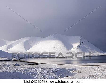 Stock Photo - "Volcanic lake with snow capped mountains on Ring Road No 1, North Iceland, Iceland, Europe". Fotosearch