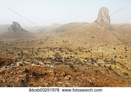 Stock Photo - "Volcanic landscape with the Kapsiki Peak, with the Harmattan haze, Mandara Mountains, Rhumsiki, Far North, Cameroon, Africa". Fotosearch