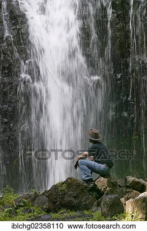 "Volcanic rock and waterfall of Labaume, hiker, towards le Puy-en-Velay, Haute Loire, Auvergne, France, Europe" View Large Photo Image Stock Image - "Volcanic rock and waterfall of Labaume, hiker, towards le Puy-en-Velay, Haute Loire, Auvergne, France, Europe". Fotosearch