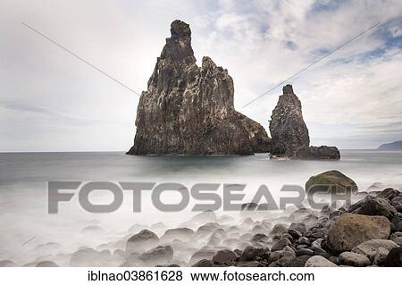 Stock Photo - "Volcanic rock formations at the cliffs near Ribeira da Janela, Atlantic Ocean, Madeira, Portugal, Europe". Fotosearch