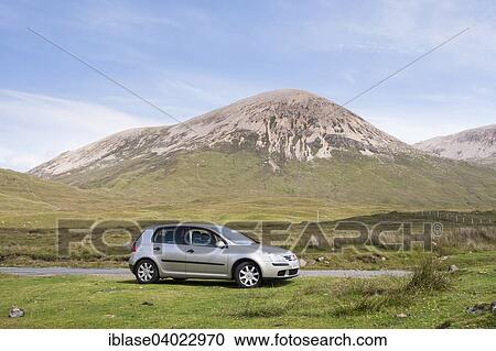 "Volkswagen Golf car parked next to road with Beinn Dearg at the back, Strathaird, Isle of Skye, Scotland, United Kingdom, Europe" View Large Photo Image Stock Image - "Volkswagen Golf car parked next to road with Beinn Dearg at the back, Strathaird, Isle of Skye, Scotland, United Kingdom, Europe". Fotosearch