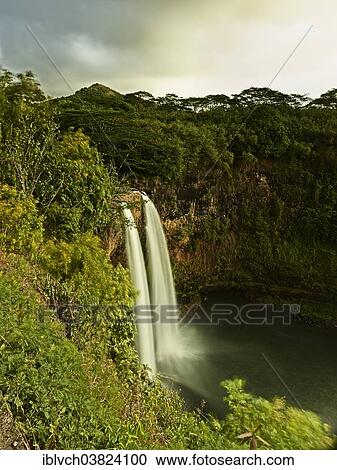 "Wailua Falls in the early morning light, Kauaʻi, Hawaii, USA" View Large Photo Image Stock Image - "Wailua Falls in the early morning light, Kauaʻi, Hawaii, USA". Fotosearch