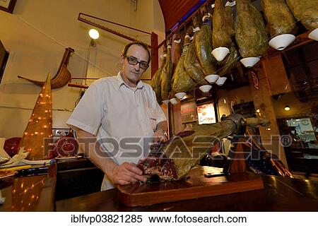 "Waiter cuts ham in the """"La Boveda"""" tapas bar, La Lonja district, Palma, Mallorca, Balearic Islands, Spain, Europe" View Large Photo Image Stock Photography - "Waiter cuts ham in the """"La Boveda"""" tapas bar, La Lonja district, Palma, Mallorca, Balearic Islands, Spain, Europe". Fotosearch