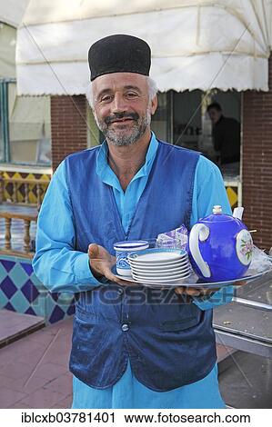 "Waiter serving tea in a traditional restaurant, Bazaar, Isfahan, Isfahan Province, Persia, Iran, Asia" View Large Photo Image Stock Image - "Waiter serving tea in a traditional restaurant, Bazaar, Isfahan, Isfahan Province, Persia, Iran, Asia". Fotosearch