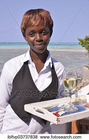 "Waitress of the restaurant """"The Rock"""", Paje, Zanzibar, Tanzania, Africa" View Large Photo Image Stock Photo - "Waitress of the restaurant """"The Rock"""", Paje, Zanzibar, Tanzania, Africa". Fotosearch