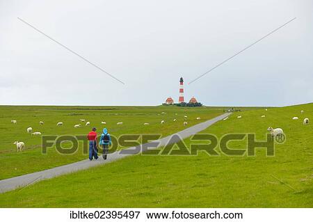 "Walkers at the Leuchtturm Westerheversand lighthouse, Westerhever, North Sea, North Frisia, Schleswig-Holstein, northern Germany, Germany, Europe" View Large Photo Image Stock Photo - "Walkers at the Leuchtturm Westerheversand lighthouse, Westerhever, North Sea, North Frisia, Schleswig-Holstein, northern Germany, Germany, Europe". Fotosearch