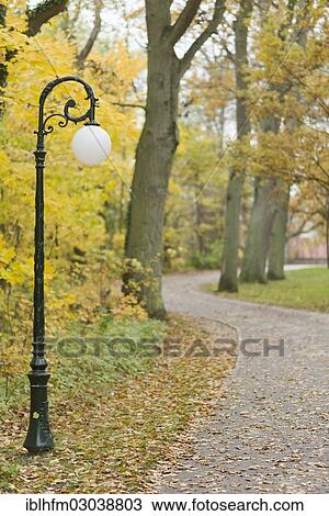 "Walkway with a lantern in a park in autumn, Insel Rugen, Ralswiek, Mecklenburg-Western Pomerania, Germany, Europe" View Large Photo Image Stock Image - "Walkway with a lantern in a park in autumn, Insel Rugen, Ralswiek, Mecklenburg-Western Pomerania, Germany, Europe". Fotosearch