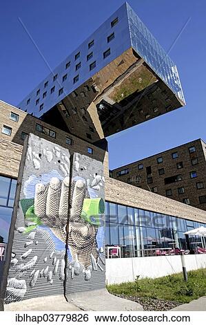 "Wall remains in front of the Nhow music and lifestyle hotel with exctravagant design, Spreespeicher, Berlin-Friedrichshain, Berlin, Germany, Europe" View Large Photo Image Stock Photograph - "Wall remains in front of the Nhow music and lifestyle hotel with exctravagant design, Spreespeicher, Berlin-Friedrichshain, Berlin, Germany, Europe". Fotosearch