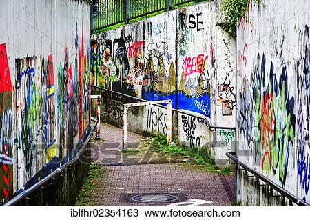 Stock Image - "Walls of a tunnel underpass defaced with graffiti, Grevenbroich, North Rhine-Westphalia, Germany, Europe". Fotosearch