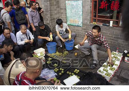 Picture - "Walnut gamblers at the market of Tianjiao, Tianjiao Markt, Beijing, China, People's Republic of China, Asia". Fotosearch