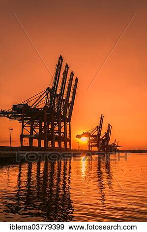 Stock Photo - "Waltershoferdamm 5 with the cranes of Container Terminal Burchardkai and EUROGATE Container Terminal, Hamburg, Germany, Europe". Fotosearch