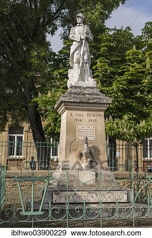 Stock Photo - "War Memorial, First World War, soldier with rifle standing on a pedestal, Gallic rooster at the bottom, further plaque with the names of fallen soldiers from the Second World War, Languedoc-Roussillon, France, Europe". Fotosearch